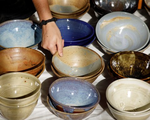 A group of stacked bowls is shown on a table