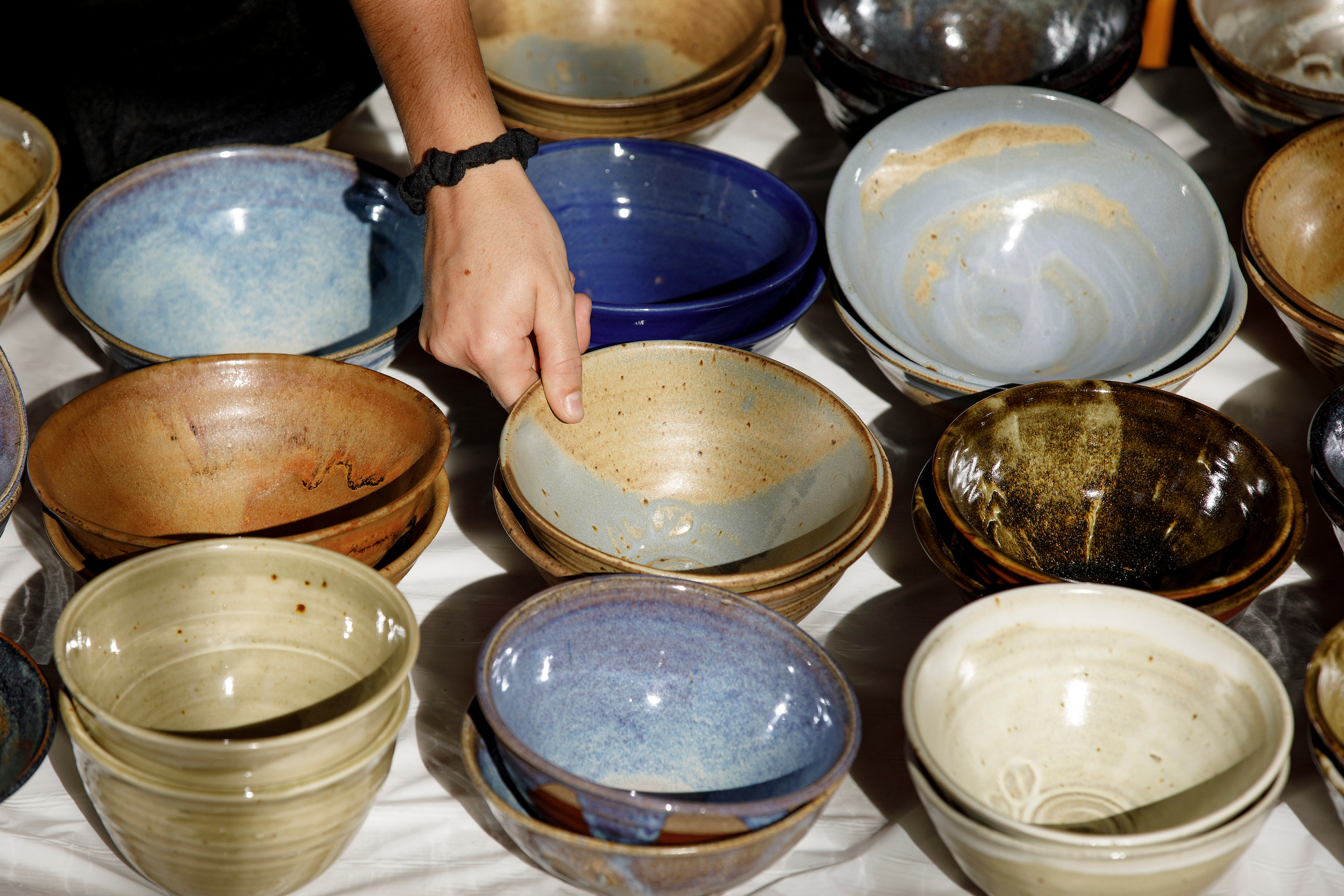 A group of stacked bowls is shown on a table